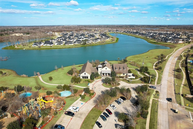 aerial view with a residential view and a water view