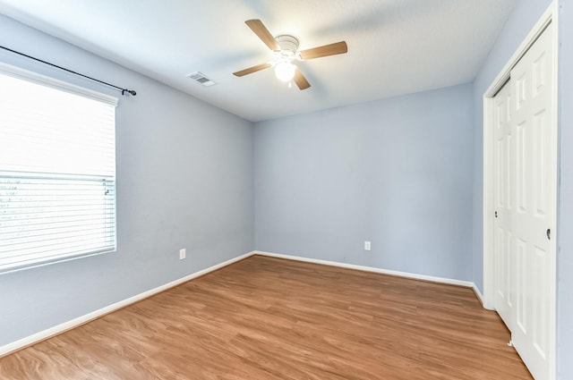 3034 Thicket Path Way, Katy, TX 77493 - unfurnished bedroom with a closet, visible vents, light wood-style flooring, and baseboards