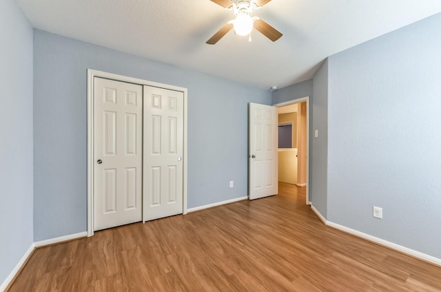 3034 Thicket Path Way, Katy, TX 77493 - unfurnished bedroom with a closet, a ceiling fan, baseboards, and light wood finished floors