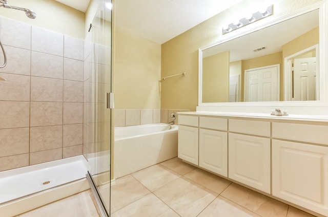 3034 Thicket Path Way, Katy, TX 77493 - full bath with vanity, visible vents, a stall shower, tile patterned flooring, and a garden tub