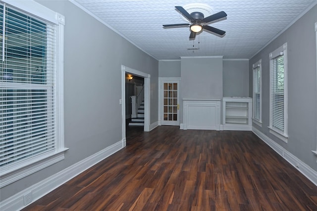 interior space featuring stairway, wood finished floors, ceiling fan, and ornamental molding