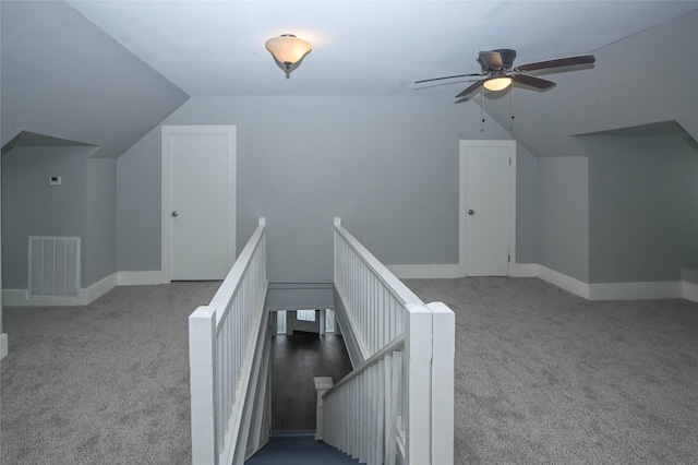 bonus room with visible vents, ceiling fan, baseboards, carpet, and lofted ceiling