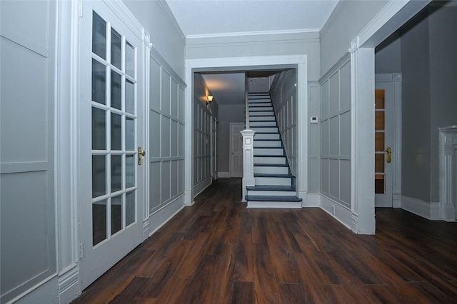 interior space featuring ornamental molding, dark wood-style flooring, french doors, baseboards, and stairs