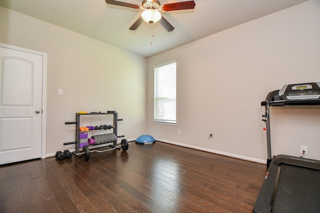 exercise room with wood finished floors, baseboards, and ceiling fan