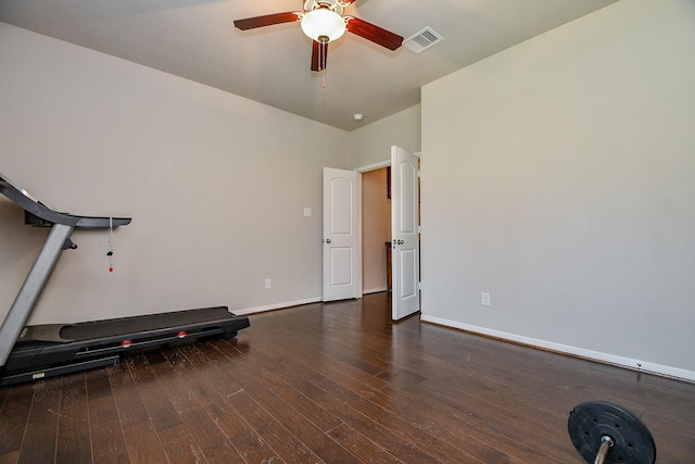 exercise area with visible vents, baseboards, a ceiling fan, and wood-type flooring