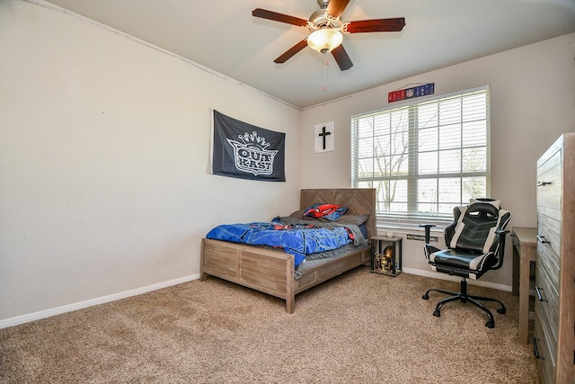 bedroom featuring baseboards, carpet floors, and a ceiling fan