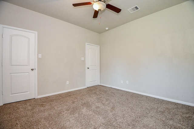 unfurnished room featuring baseboards, visible vents, carpet floors, and ceiling fan