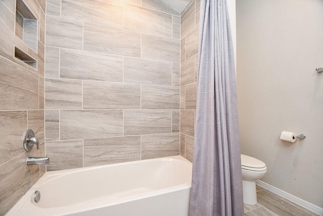 30903 Roanoak Woods Dr, Tomball, TX 77375 - full bathroom with baseboards, shower / tub combo, and toilet