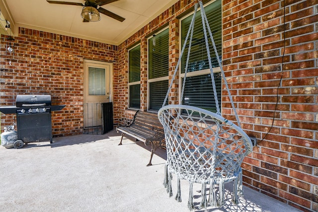 view of patio / terrace with grilling area and a ceiling fan