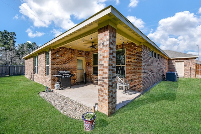 exterior space featuring central air condition unit, a ceiling fan, fence, and a grill