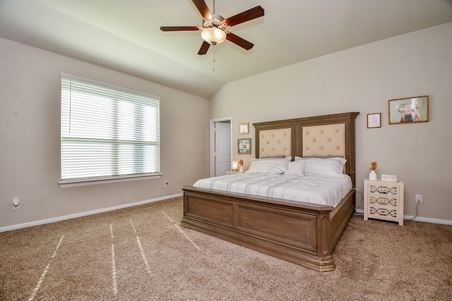 bedroom featuring light carpet, baseboards, and lofted ceiling