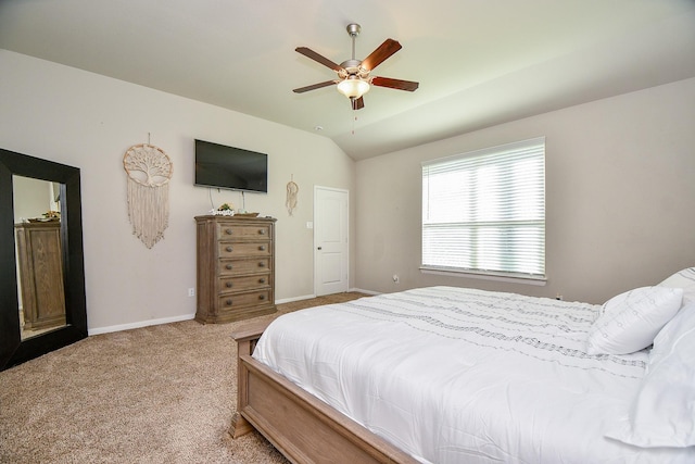 bedroom featuring baseboards, carpet floors, lofted ceiling, and a ceiling fan