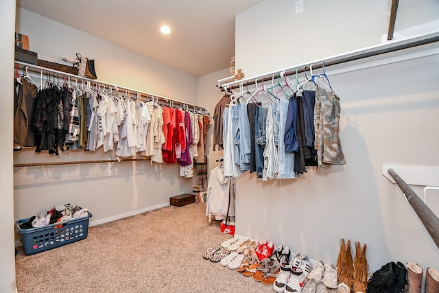 spacious closet with carpet floors