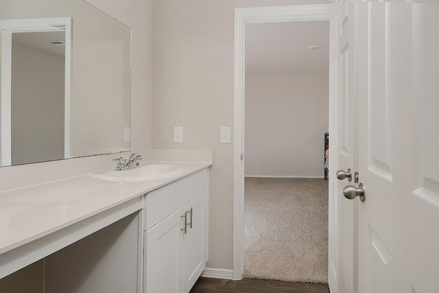 bathroom featuring baseboards and vanity