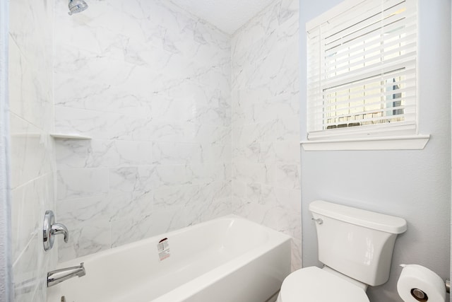 bathroom featuring toilet and tub / shower combination