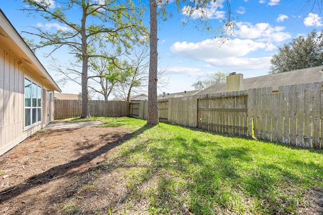 view of yard with a fenced backyard