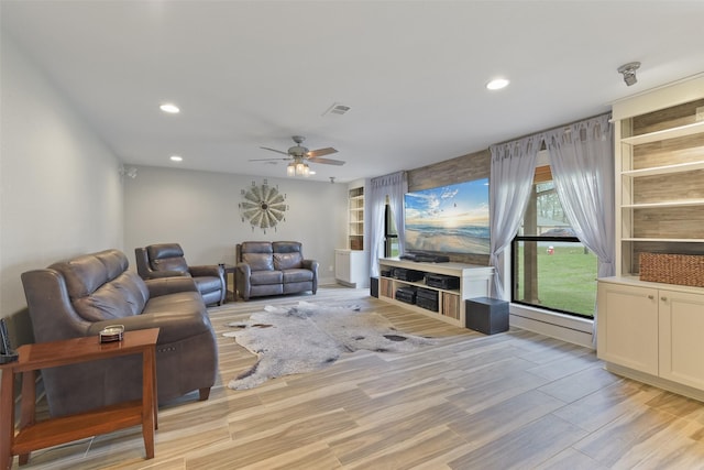 living area with visible vents, recessed lighting, light wood-type flooring, and ceiling fan