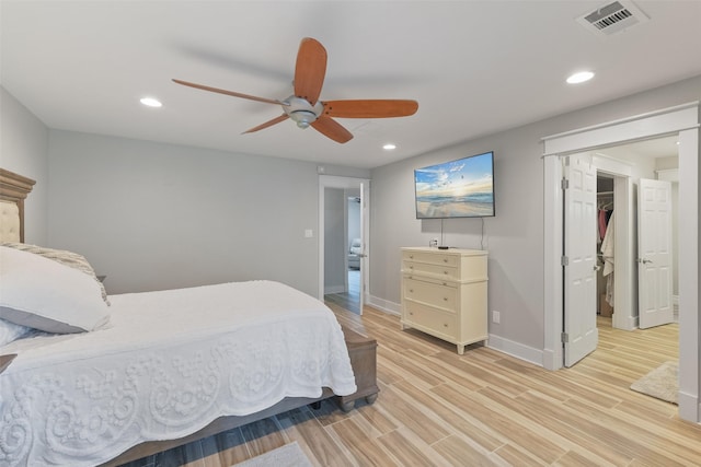 bedroom with light wood-type flooring, visible vents, a ceiling fan, recessed lighting, and baseboards