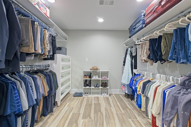 spacious closet with visible vents and wood finish floors