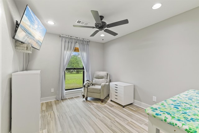 interior space with visible vents, a ceiling fan, recessed lighting, light wood finished floors, and baseboards