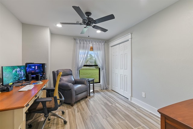 office space featuring recessed lighting, baseboards, light wood-type flooring, and ceiling fan