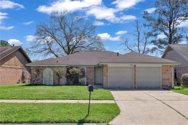 ranch-style house with concrete driveway, brick siding, a garage, and a front lawn