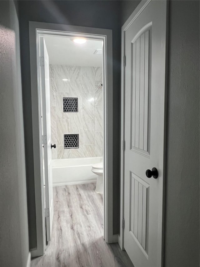 hallway featuring wood finished floors