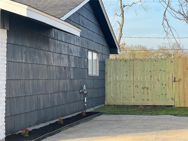 view of side of home with fence