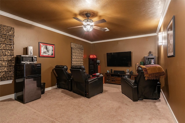 home theater featuring baseboards, light carpet, a ceiling fan, and crown molding