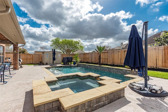 view of pool featuring a storage unit, an outbuilding, a fenced backyard, an in ground hot tub, and a patio area