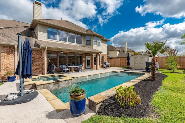 rear view of property with a patio, a storage shed, a fenced backyard, and brick siding