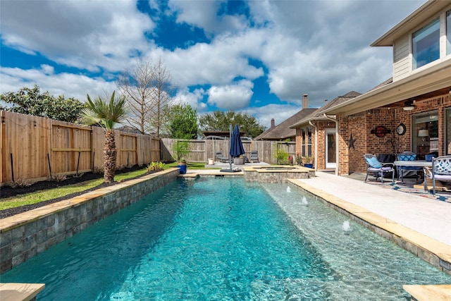 view of pool with a patio area, a pool with connected hot tub, a ceiling fan, and a fenced backyard