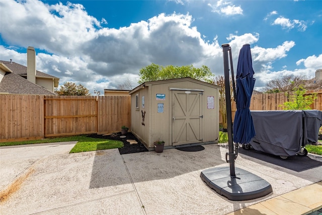 view of shed featuring a fenced backyard