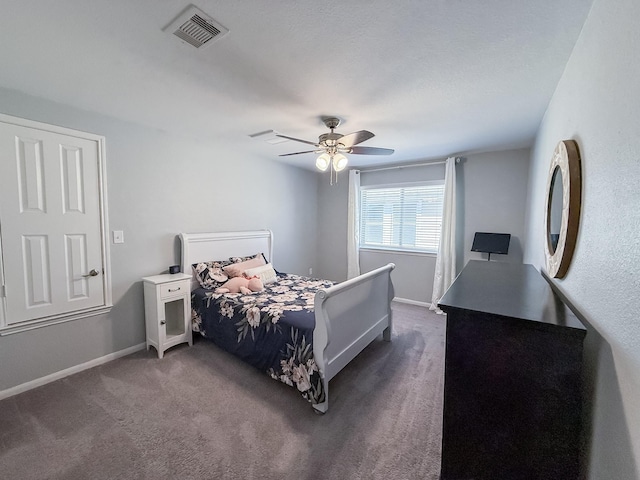 bedroom featuring carpet flooring, a ceiling fan, visible vents, and baseboards