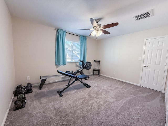 workout area with visible vents, baseboards, carpet, and ceiling fan