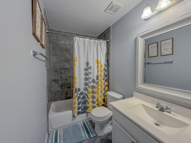 bathroom with visible vents, toilet, shower / bath combination with curtain, vanity, and a textured wall