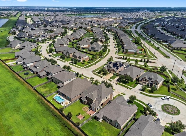 birds eye view of property with a residential view