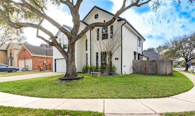 view of front of property with brick siding, concrete driveway, a front lawn, and fence