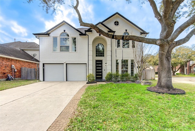 view of front facade featuring brick siding, a garage, concrete driveway, and a front yard