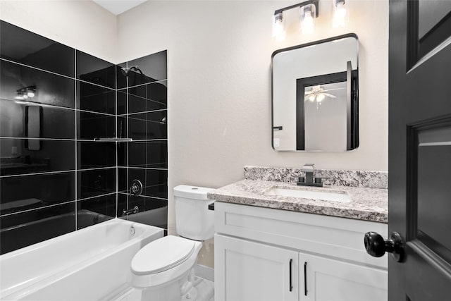 bathroom featuring baseboards, toilet, shower / bathtub combination, vanity, and a ceiling fan