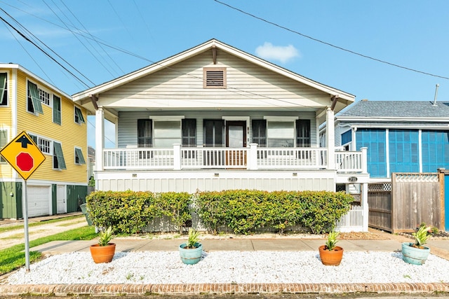 view of front of home featuring fence