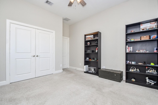 bedroom with visible vents, ceiling fan, baseboards, carpet, and a closet