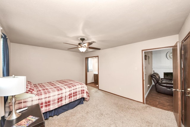 bedroom with visible vents, carpet, and ceiling fan