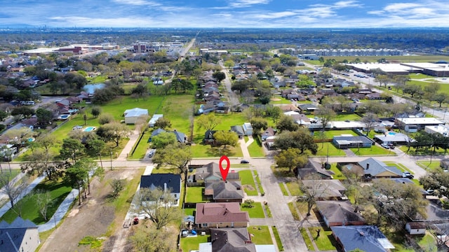 birds eye view of property with a residential view