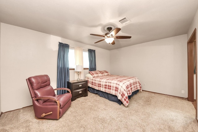 bedroom featuring a ceiling fan, carpet, and visible vents