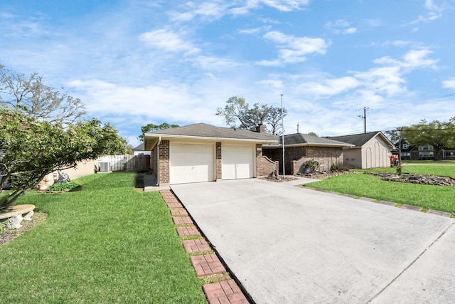 view of front of property featuring a front lawn, fence, concrete driveway, brick siding, and a chimney