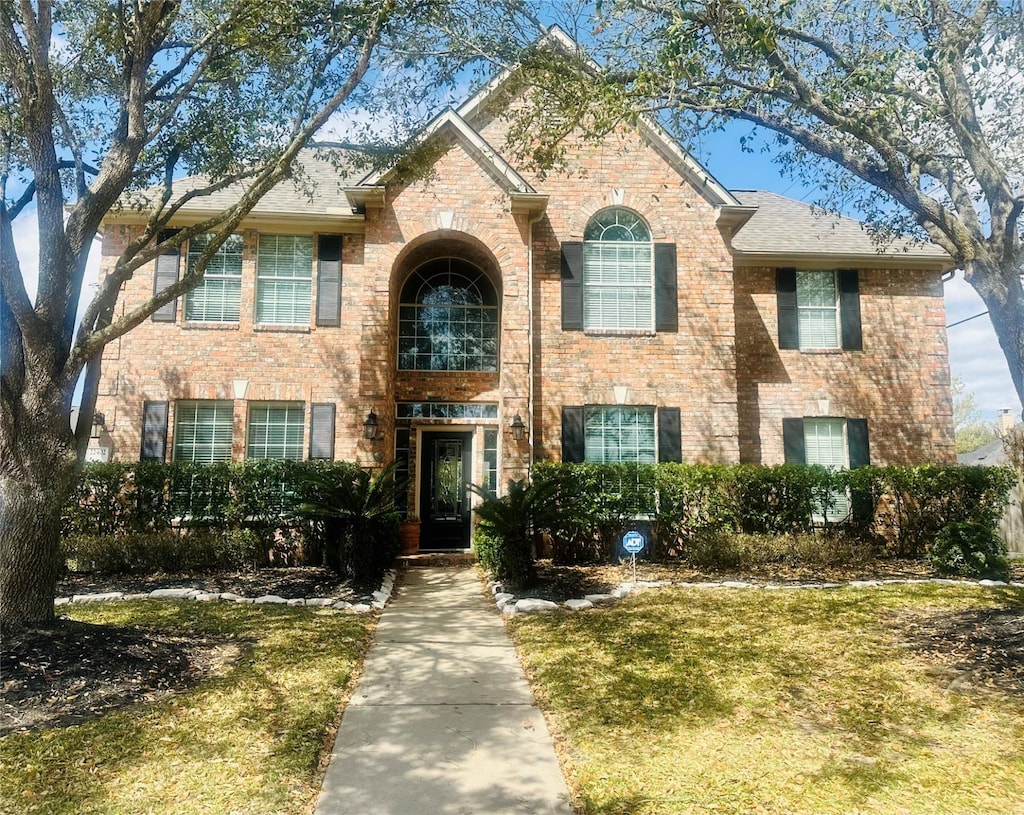 view of front of house with brick siding