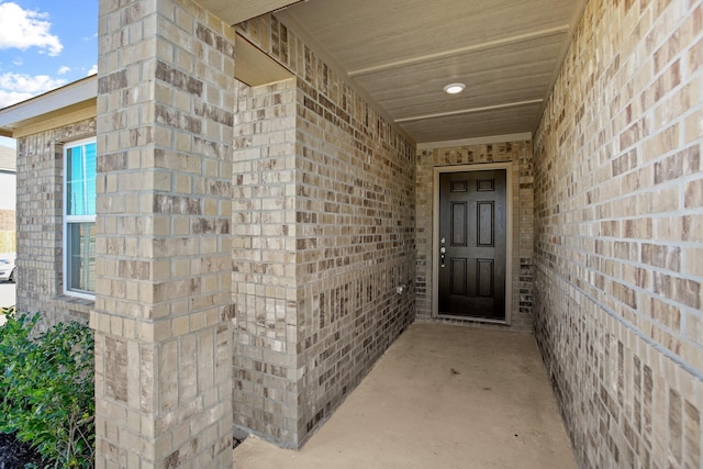 entrance to property with brick siding