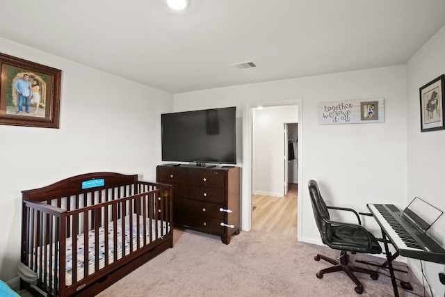 bedroom featuring visible vents, baseboards, and carpet floors