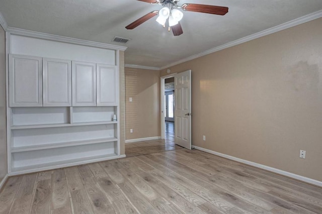 unfurnished bedroom with visible vents, crown molding, ceiling fan, baseboards, and light wood-style floors